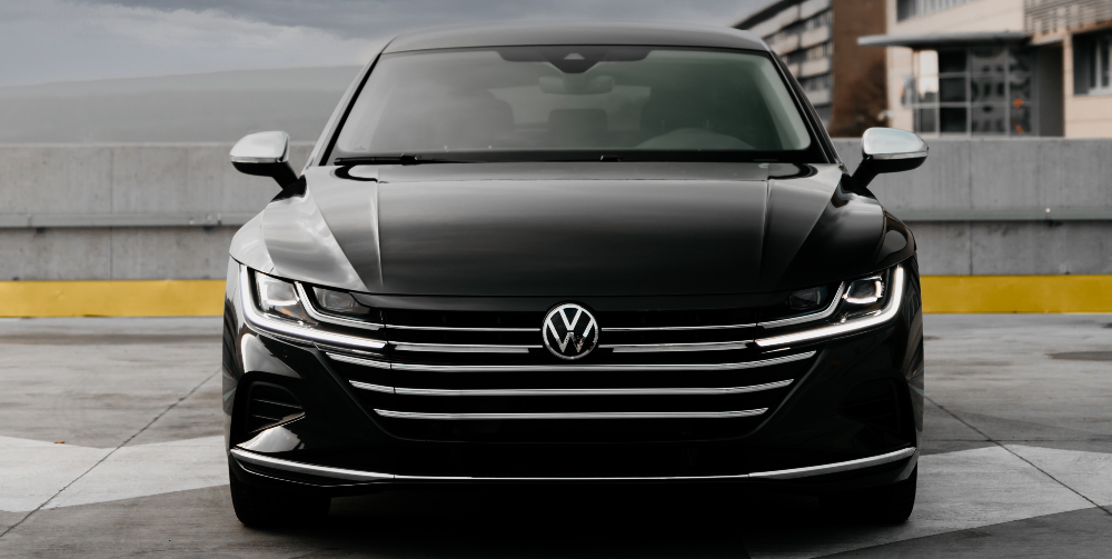Volkswagen logo on front of black car